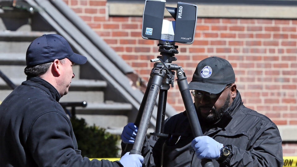 Boston Police Department officers at a crime scene