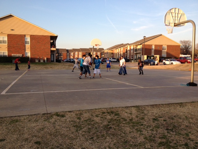 Frisco Police officers play basketball with community members