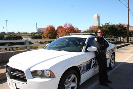 Winston-Salem Police Department officer in front of car