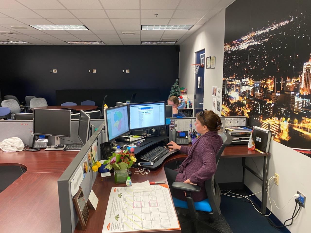 Roanoke police officer at desk